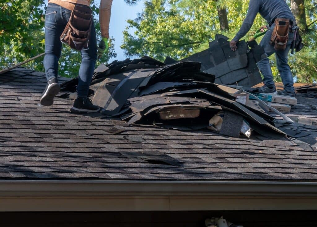 workers inspecting roof