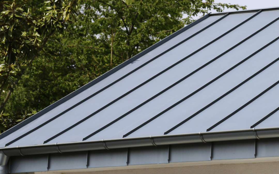 Close up of a house with a new metal gutters and roof